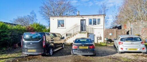 Detached four-bedroom home in Johnstone, Scotland, hits the market for £147,000. Ideal buy-to-let opportunity with long-term tenants, spacious rooms, and ample parking.