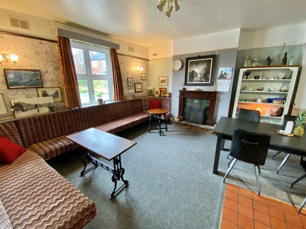 Unassuming four-bedroom house for under £400,000 in Macclesfield has a secret pub inside. Former Navigation pub, now a unique home, offers versatile space and project potential.