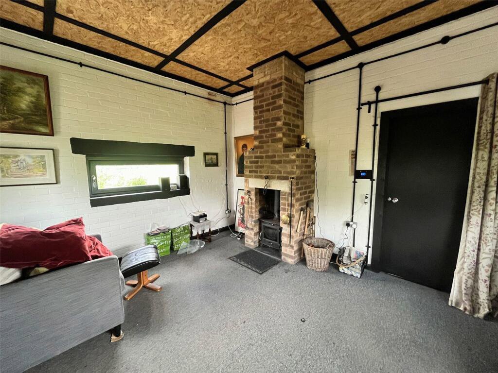 Tiny property in Welton, Northamptonshire, converted from an old pump station, is on sale for £75,000. Features solar panels, rainwater tank, and parking for four cars.