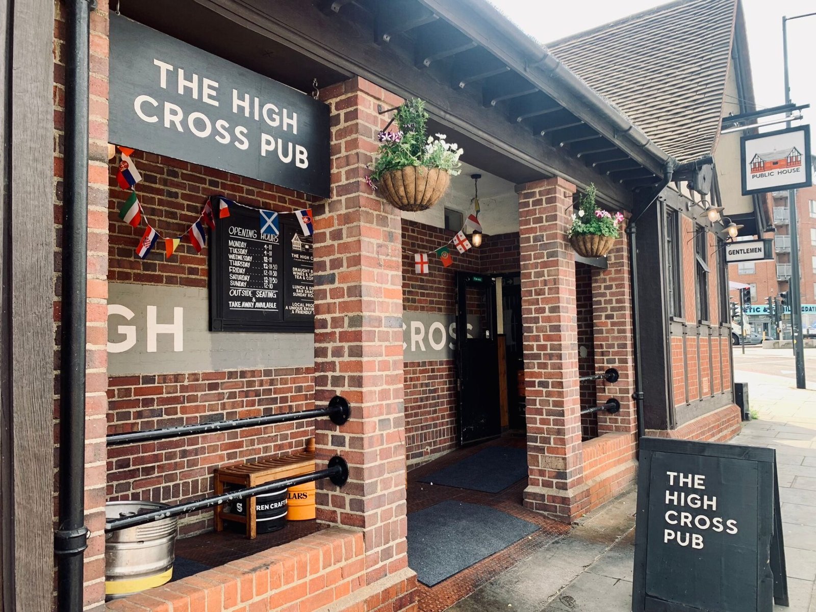 The High Cross Pub in Tottenham, a cozy spot in a former public toilet, perfect for watching the Euros with great pints, delicious food, and a unique charm.
