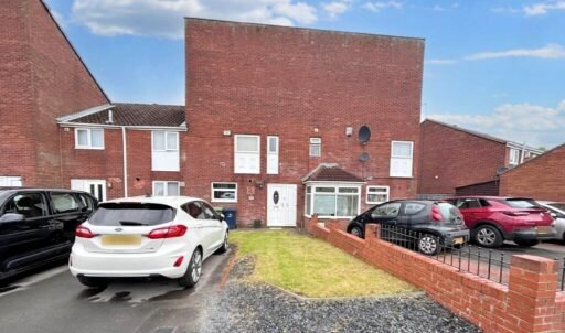 A three-bedroom house in Stanhope, near Newcastle, mocked for resembling Ant McPartlin's forehead, is on sale for £135,000. Spacious lounge, modern kitchen, and a backyard.