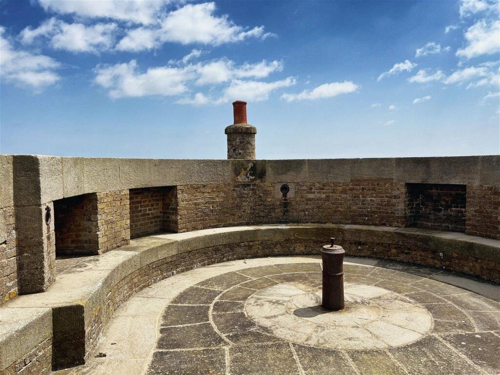 A 19th-century Martello tower in Suffolk, transformed into a quirky home with panoramic North Sea views, is for sale at £450,000. Features 3 bedrooms and a historic gun deck.