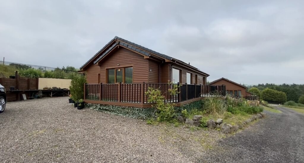 A quirky £300,000 bungalow near Kinross, Scotland, features a full model railway around the driveway, spacious living areas, two bedrooms, and a huge garage with conversion potential.