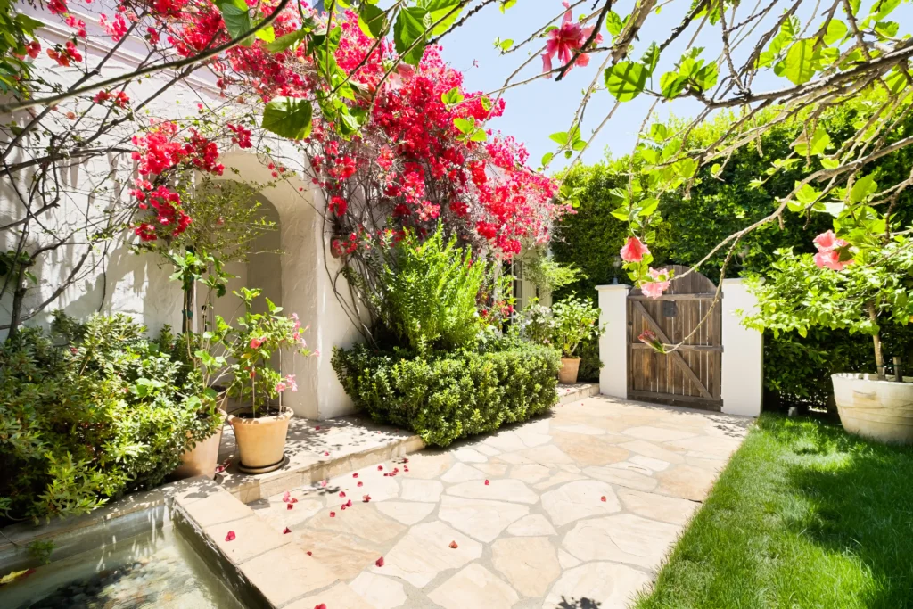 The storybook bungalow, once owned by Hollywood actor Robert Duvall, is for sale at $2M. This charming 1920s two-bed home in West Hollywood features a courtyard, pool, and lush gardens.