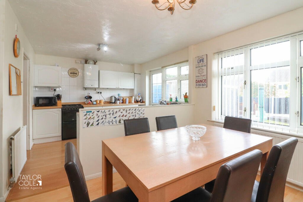 House hunters amused by Scottish-themed home next to England-flagged neighbor in Leicestershire. Priced at £220,000, this semi-detached property features Saltire decor.