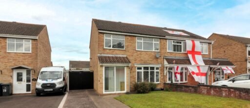 House hunters amused by Scottish-themed home next to England-flagged neighbor in Leicestershire. Priced at £220,000, this semi-detached property features Saltire decor.