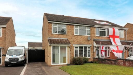 House hunters amused by Scottish-themed home next to England-flagged neighbor in Leicestershire. Priced at £220,000, this semi-detached property features Saltire decor.