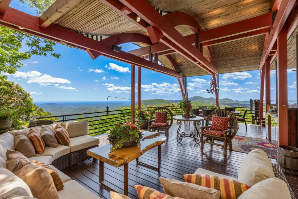 Burt Reynolds' iconic mountain cabin in North Carolina, featured in "Deliverance," sells for $2.9M. Explore the luxurious retreat with breathtaking Blue Ridge Mountain views.