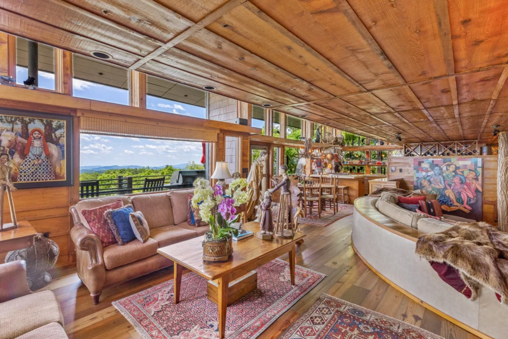 Burt Reynolds' iconic mountain cabin in North Carolina, featured in "Deliverance," sells for $2.9M. Explore the luxurious retreat with breathtaking Blue Ridge Mountain views.