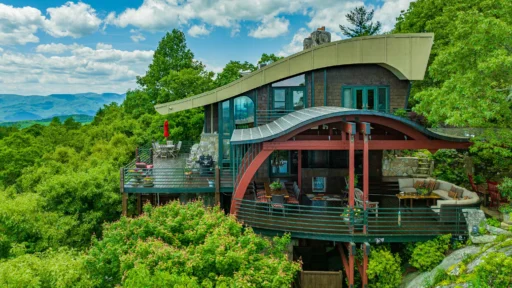 Burt Reynolds' iconic mountain cabin in North Carolina, featured in "Deliverance," sells for $2.9M. Explore the luxurious retreat with breathtaking Blue Ridge Mountain views.