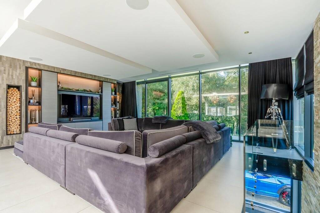 Tottenham's James Maddison lists £2.5M house with its own football pitch, outdoor pool, and bar featuring Premier League stars' shirts. Luxurious property boasts top security.