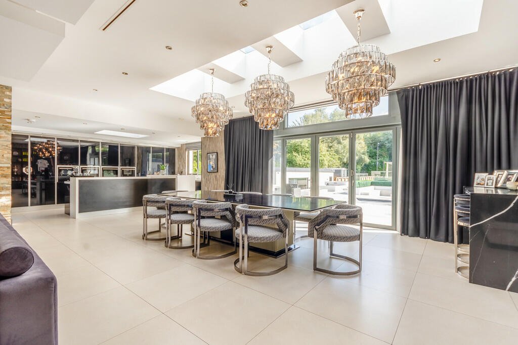 Tottenham's James Maddison lists £2.5M house with its own football pitch, outdoor pool, and bar featuring Premier League stars' shirts. Luxurious property boasts top security.