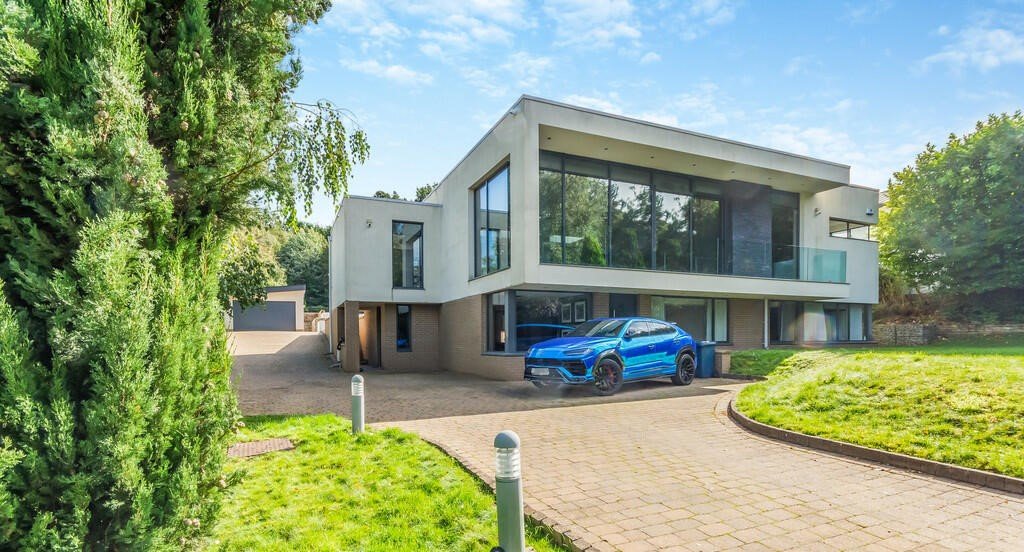 Tottenham's James Maddison lists £2.5M house with its own football pitch, outdoor pool, and bar featuring Premier League stars' shirts. Luxurious property boasts top security.