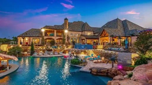 Luxury $17M mansion in Oklahoma City boasts 8 bedrooms, 16 bathrooms, dance floor, bar, bowling alley, sports courts, 70,000-gallon pool, and 36 acres of land. Ultimate entertainer's paradise.