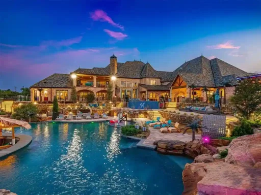 Luxury $17M mansion in Oklahoma City boasts 8 bedrooms, 16 bathrooms, dance floor, bar, bowling alley, sports courts, 70,000-gallon pool, and 36 acres of land. Ultimate entertainer's paradise.