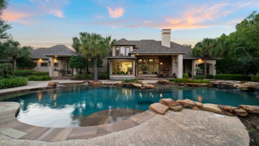 Luxury Houston mansion with 10-island lake, Japanese gardens, and helipad hits market for $19.8M. Includes 227 acres, private bass lake, resort-style pool, guest house, and more.