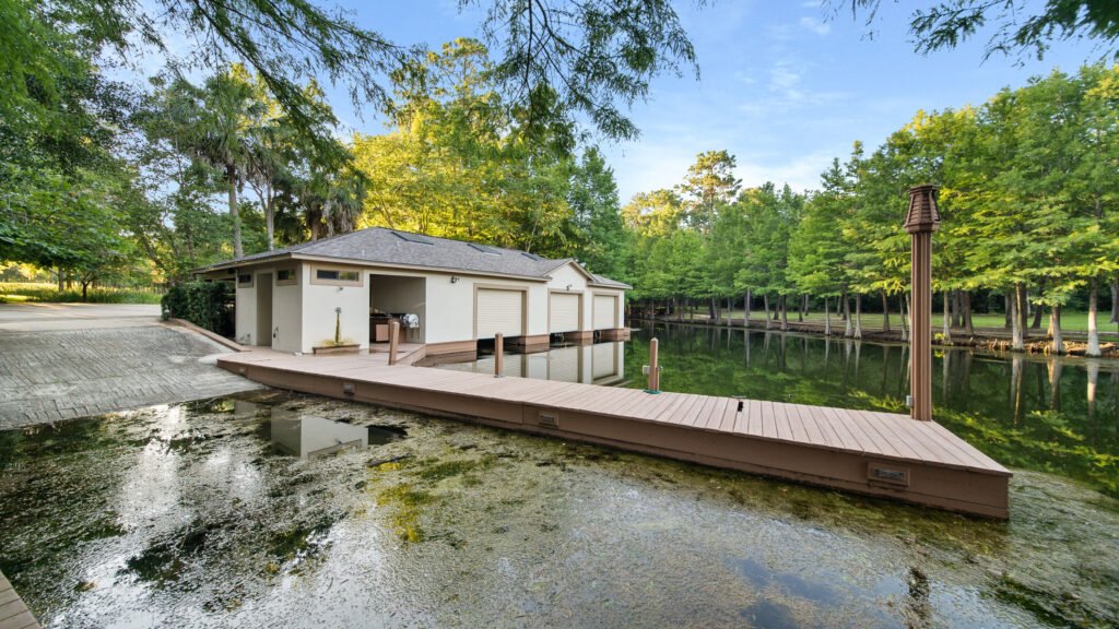 Luxury Houston mansion with 10-island lake, Japanese gardens, and helipad hits market for $19.8M. Includes 227 acres, private bass lake, resort-style pool, guest house, and more.