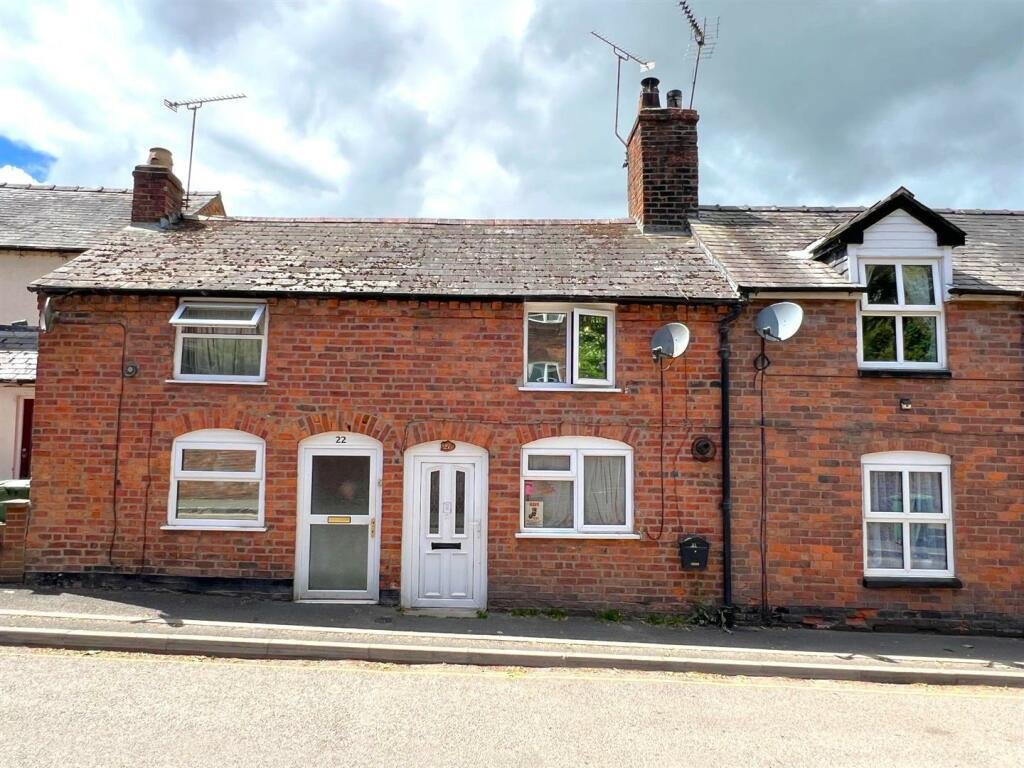 Quirky £124,000 home in Ellesmere, Shropshire features an exposed toilet with no walls or door, charming garden, and unique character, attracting thrill seekers and curious buyers.