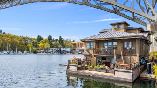 Stunning floating mansion "Aurora" on Lake Union, Seattle, hits the market for $3.9 million. This 4,850 sq ft luxury home boasts three bedrooms, gourmet kitchen, and incredible views.