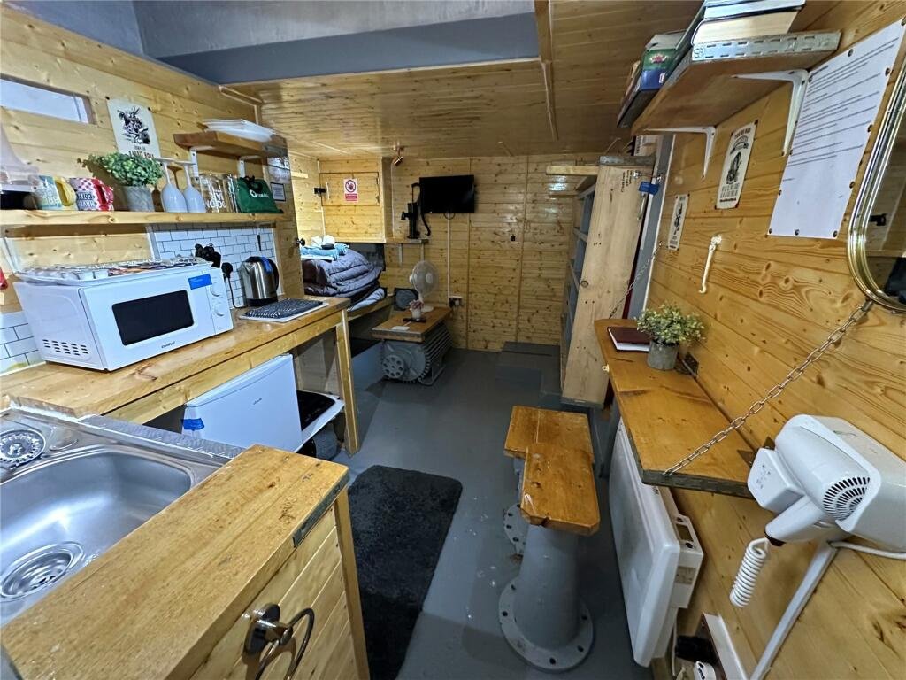 Cornwall 'bunker' listed for £45,000—perfect for the apocalypse. This unique micro-home, formerly a pumping station, offers quirky, industrial-themed living space.