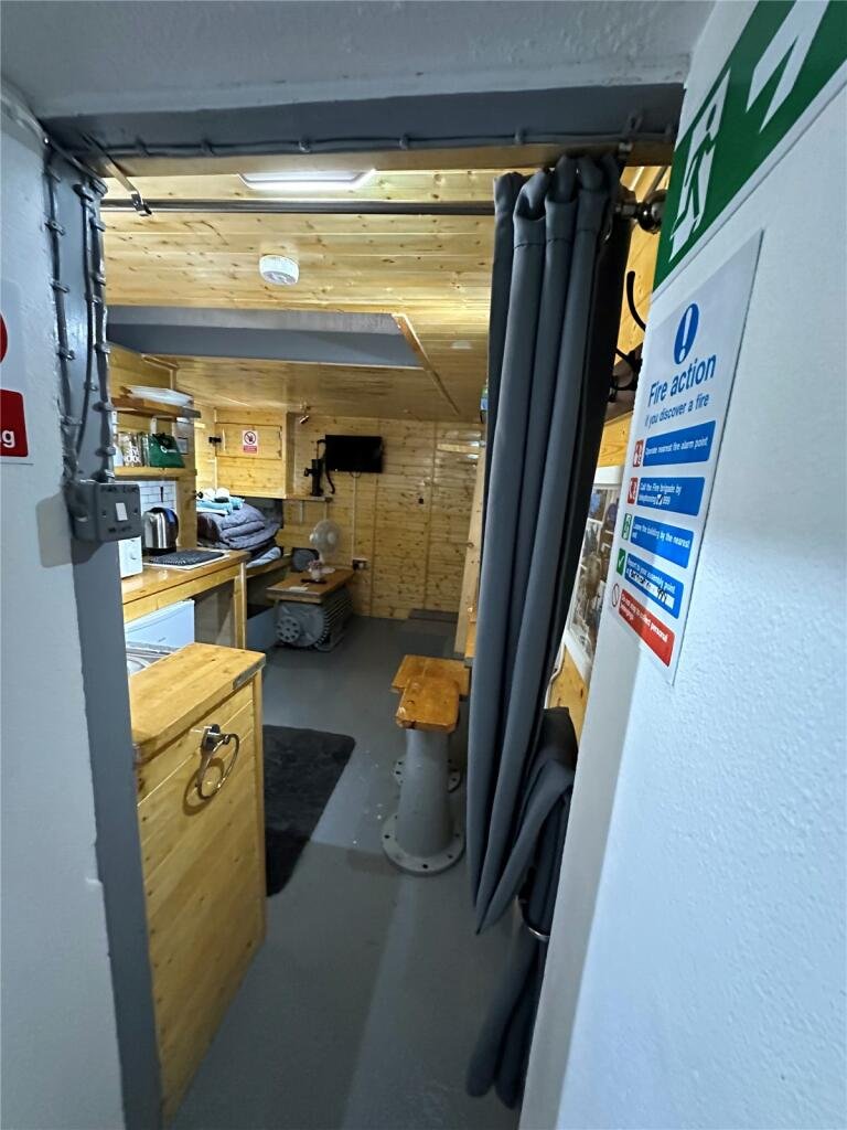 Cornwall 'bunker' listed for £45,000—perfect for the apocalypse. This unique micro-home, formerly a pumping station, offers quirky, industrial-themed living space.