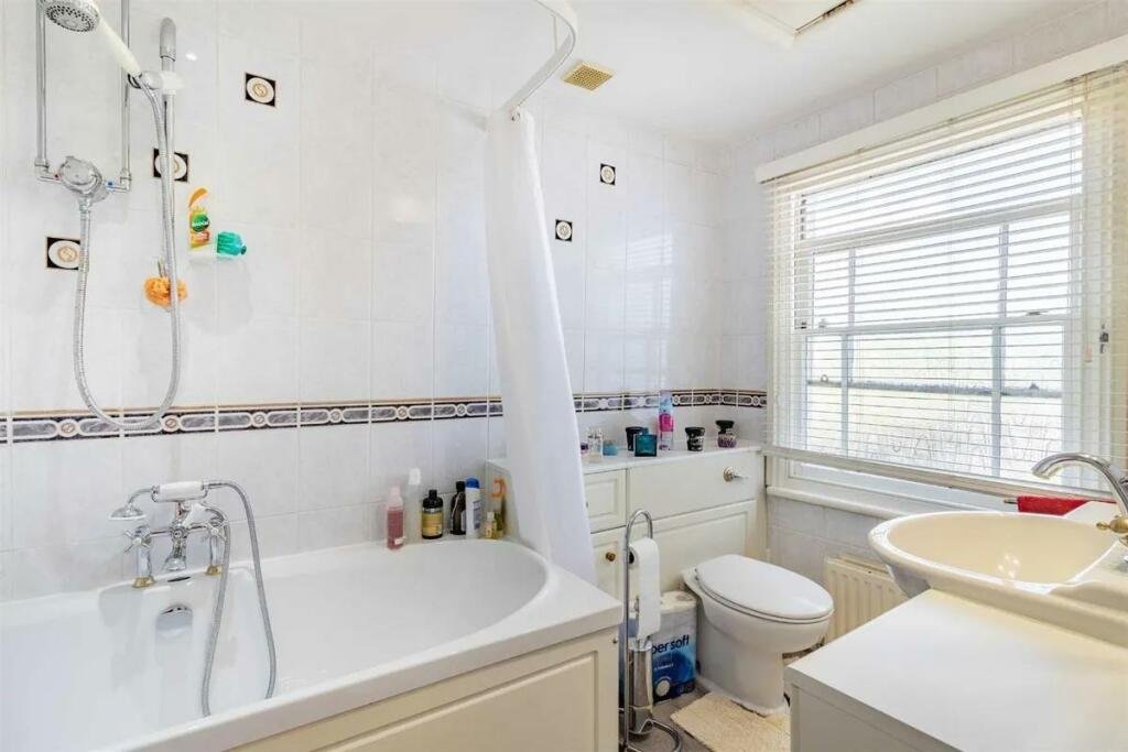 A charming cottage with a unique twist is on the market for £485,000, featuring a front door accessed through a bustling pub garden in Chenies Village, Herefordshire.