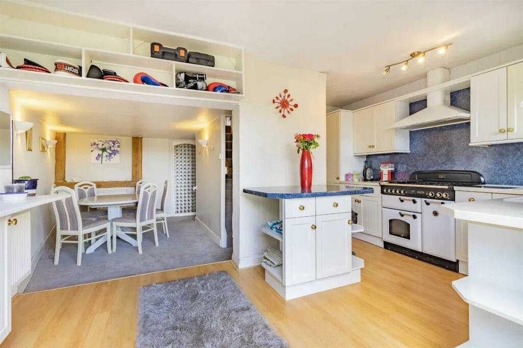 A charming cottage with a unique twist is on the market for £485,000, featuring a front door accessed through a bustling pub garden in Chenies Village, Herefordshire.