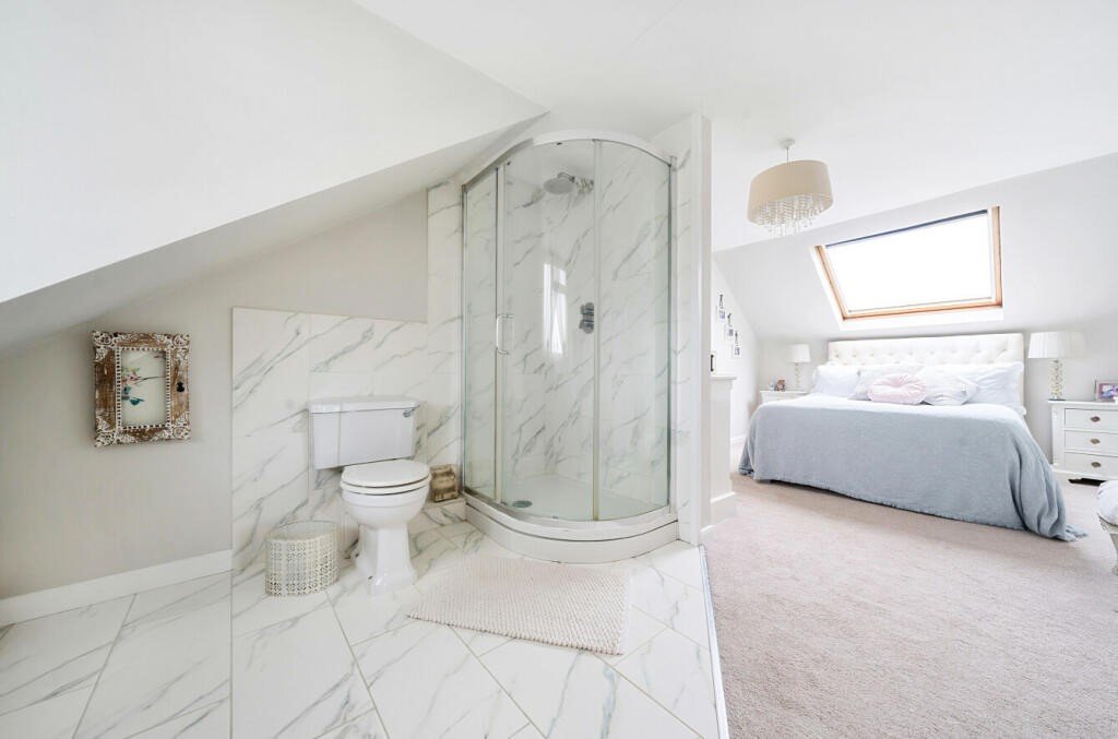 A £550,000 home in Saffron Walden, Essex, features a unique open-plan en-suite in the master bedroom, raising hygiene concerns and sparking curiosity. Discover the quirky design!