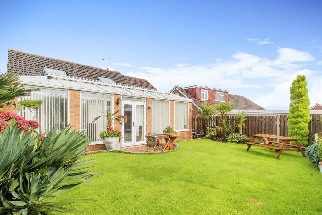 Quirky £360,000 bungalow in Leeds features a pink bedroom with a toilet just inches from the bed, sparking curiosity. A unique find with four bedrooms and open-plan living.