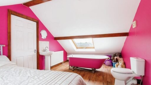 Quirky £360,000 bungalow in Leeds features a pink bedroom with a toilet just inches from the bed, sparking curiosity. A unique find with four bedrooms and open-plan living.