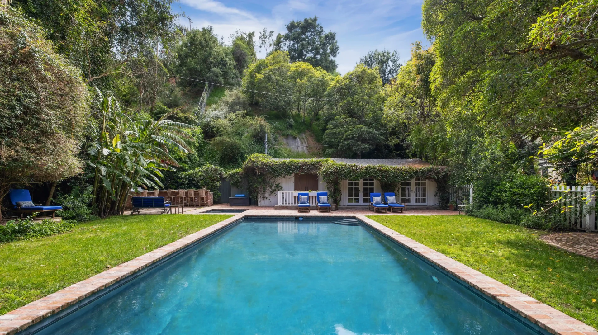 Michelle Pfeiffer's former Pacific Palisades estate, featuring luxurious amenities and Hollywood history, sells for $14M. Discover the star-studded property’s stunning details.