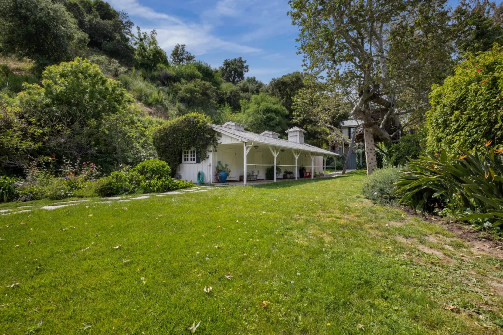 Michelle Pfeiffer's former Pacific Palisades estate, featuring luxurious amenities and Hollywood history, sells for $14M. Discover the star-studded property’s stunning details.