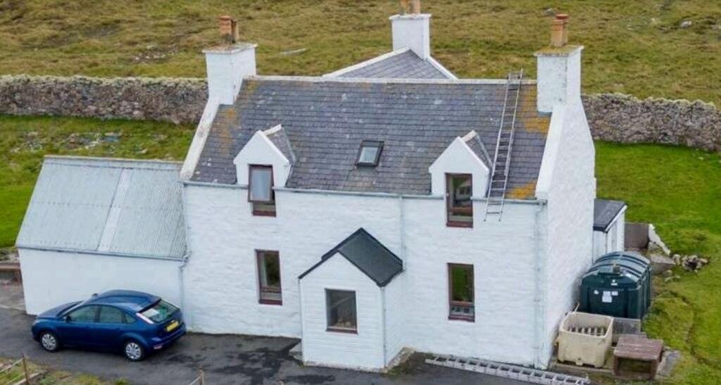 A secluded former schoolhouse on the Shetland Islands is up for auction at £80,000. Accessible only by ferry, this unique home features a private cinema and indoor spa.