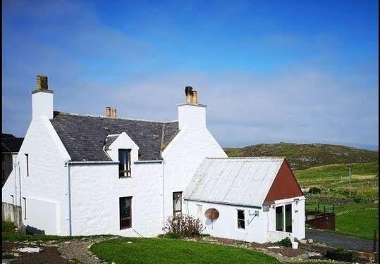 A secluded former schoolhouse on the Shetland Islands is up for auction at £80,000. Accessible only by ferry, this unique home features a private cinema and indoor spa.