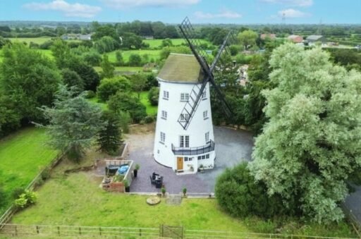 Historic 17th-century windmill converted into a modern family home with original features, 1.65 acres, and planning permission, now on the market near Chester for £850,000.