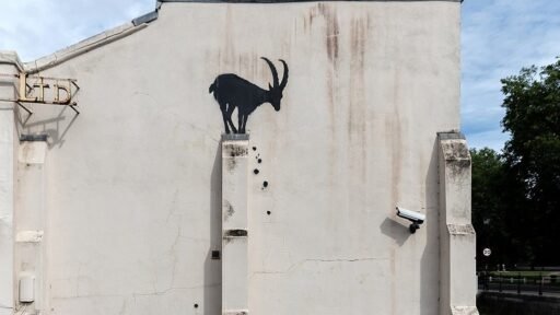 Banksy's new artwork on a building in Richmond, London, could double the property’s value, adding £500-£800k. The goat-themed piece has fans and experts buzzing about its impact.