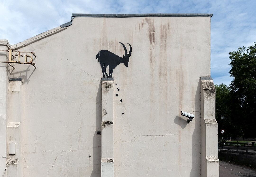 Banksy's new artwork on a building in Richmond, London, could double the property’s value, adding £500-£800k. The goat-themed piece has fans and experts buzzing about its impact.