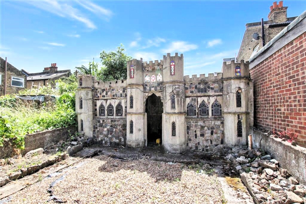 Unassuming London home for sale hides a castle-themed playhouse in the garden, offering a unique feature fit for royalty. Three-bed property listed for £500,000.