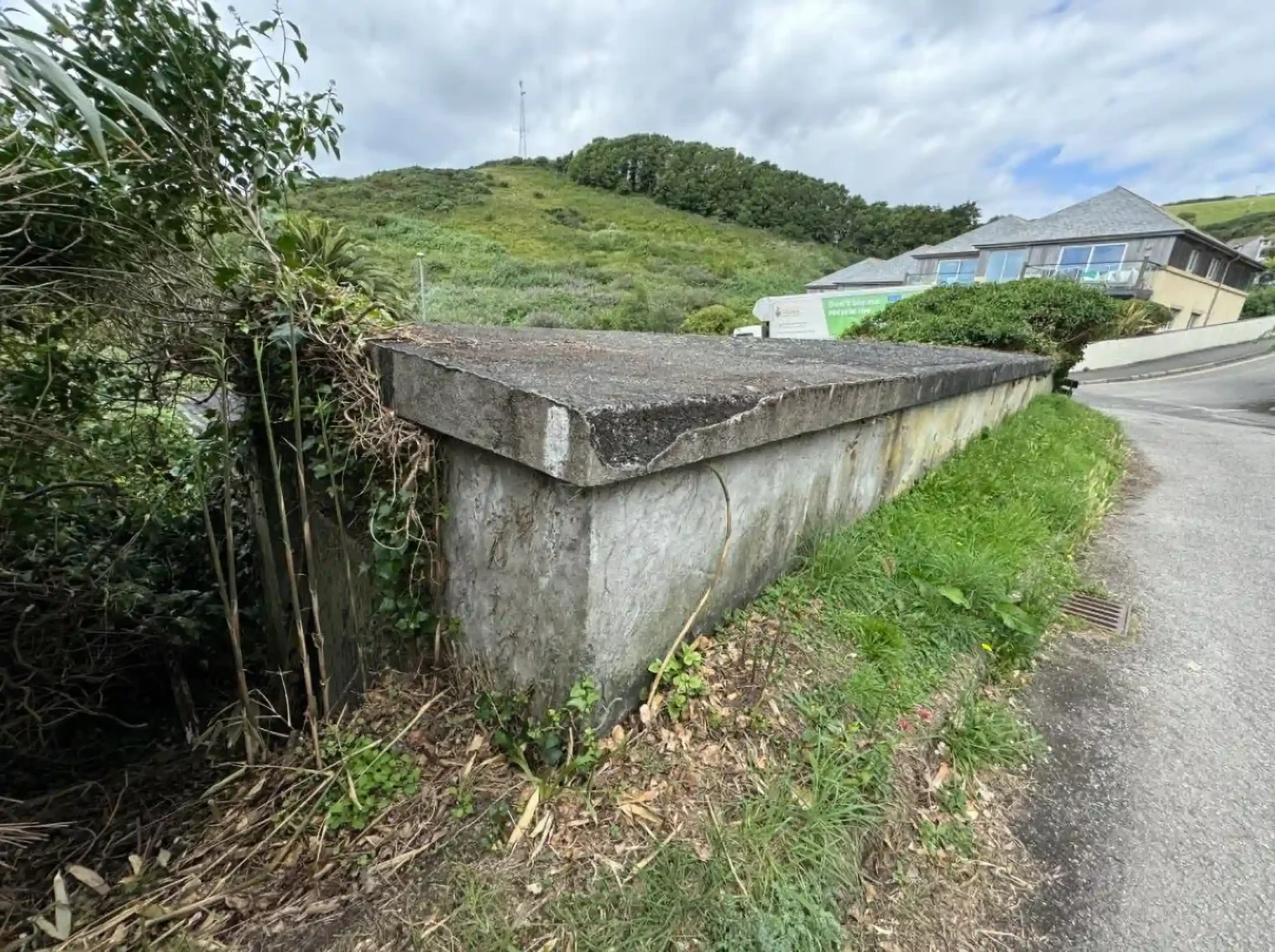 A former WWII bomb shelter with stunning sea views in Downderry, Cornwall is up for auction for just £25,000—perfect for a workshop or storage space.