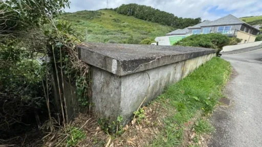 A former WWII bomb shelter with stunning sea views in Downderry, Cornwall is up for auction for just £25,000—perfect for a workshop or storage space.