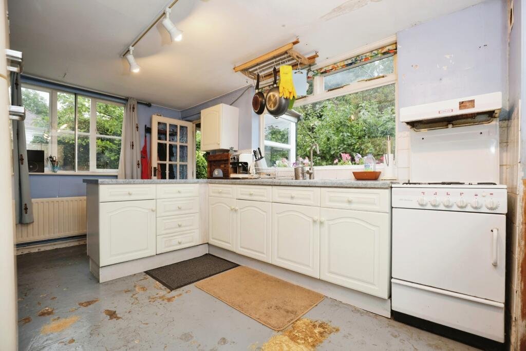 Quirky detached house near Stratford-upon-Avon for sale at £175,000, featuring two bedrooms, a garden, and a unique toilet under the stairs. Auction ends soon!