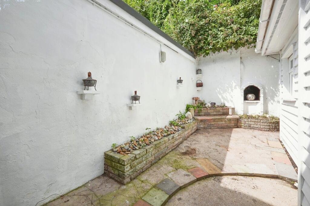 Charming two-bedroom cottage near the White Cliffs of Dover, listed for £180,000, features a unique garden cave and Victorian character, just minutes from the town's port.