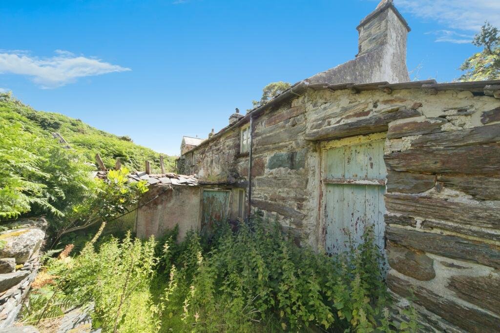 Idyllic 3-bed cottage in Welsh countryside for sale at just £140,000, but with a catch—extensive damage means no unaccompanied or internal viewings allowed. Perfect for renovators!