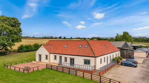 Discover Arthington Barn Stables—a 23-acre equestrian haven in North Yorkshire with 55 stables, gallops, a 3-bedroom house, and development potential. On the market now.