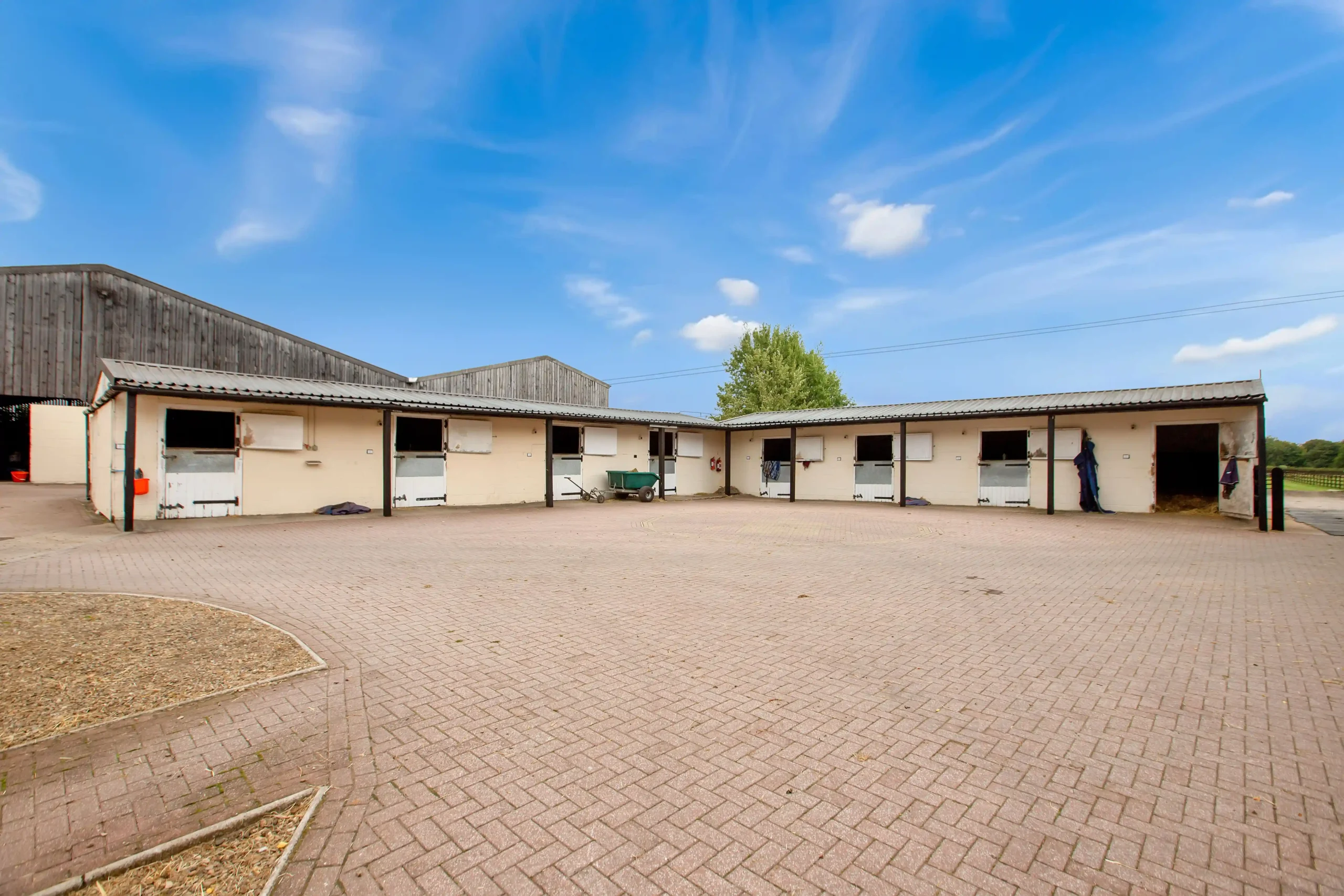 Discover Arthington Barn Stables—a 23-acre equestrian haven in North Yorkshire with 55 stables, gallops, a 3-bedroom house, and development potential. On the market now.