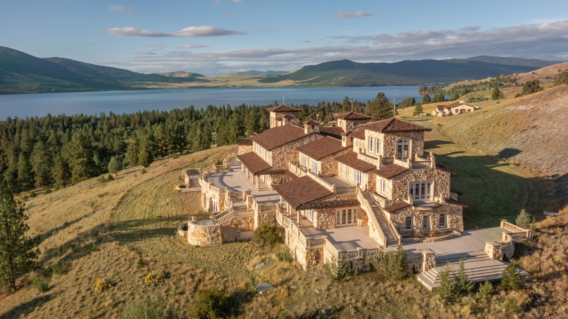 A $72M island in Montana's Flathead Lake, with a 45,000 sq ft home, stunning views, and its very own Loch Ness-style 'monster,' is now for sale—perfect for luxury and adventure!