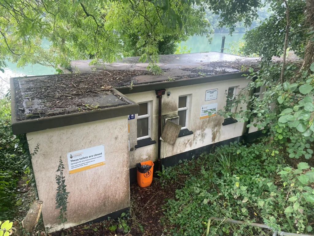 A disused riverside toilet block with stunning views over the River Fal in Malpas, Cornwall, is up for auction at £30,000, offering a unique renovation opportunity despite its quirky past.