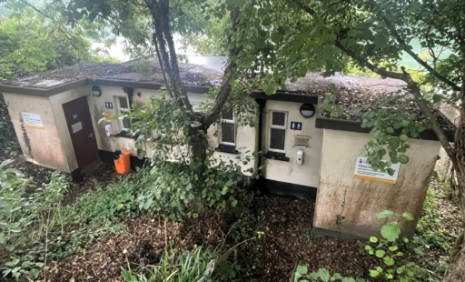 A disused riverside toilet block with stunning views over the River Fal in Malpas, Cornwall, is up for auction at £30,000, offering a unique renovation opportunity despite its quirky past.