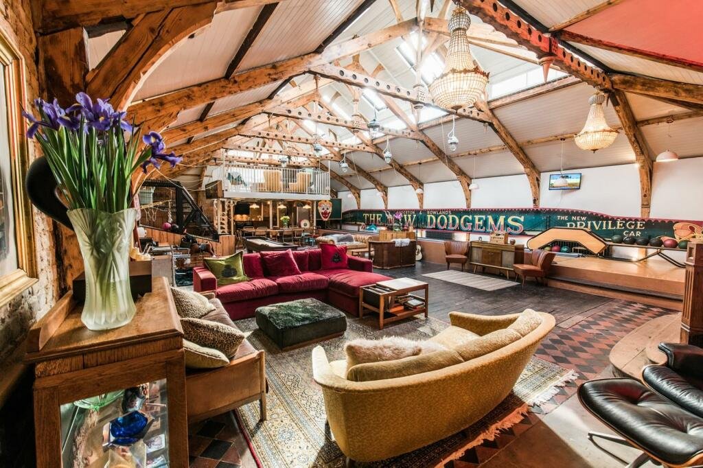 Victorian bathhouse turned quirky family home hits the market for £1.1M, featuring circus-themed décor, a bowling alley, cinema room, and sun terrace in East Sussex.