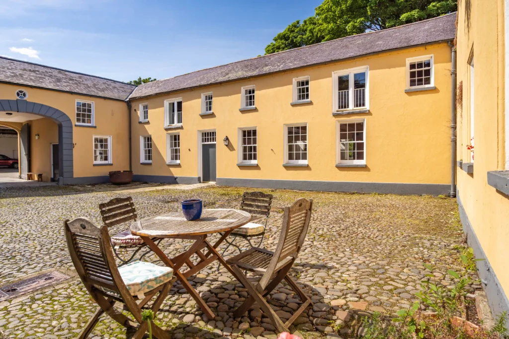 A fairy tale-like castle, Elmfield, built in 1850, is on the market for £3.35M. Nestled in Northern Ireland, this 90-acre estate offers historic charm and modern luxury.